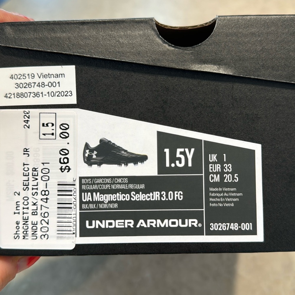 Under Armour boys cleats size 1.5